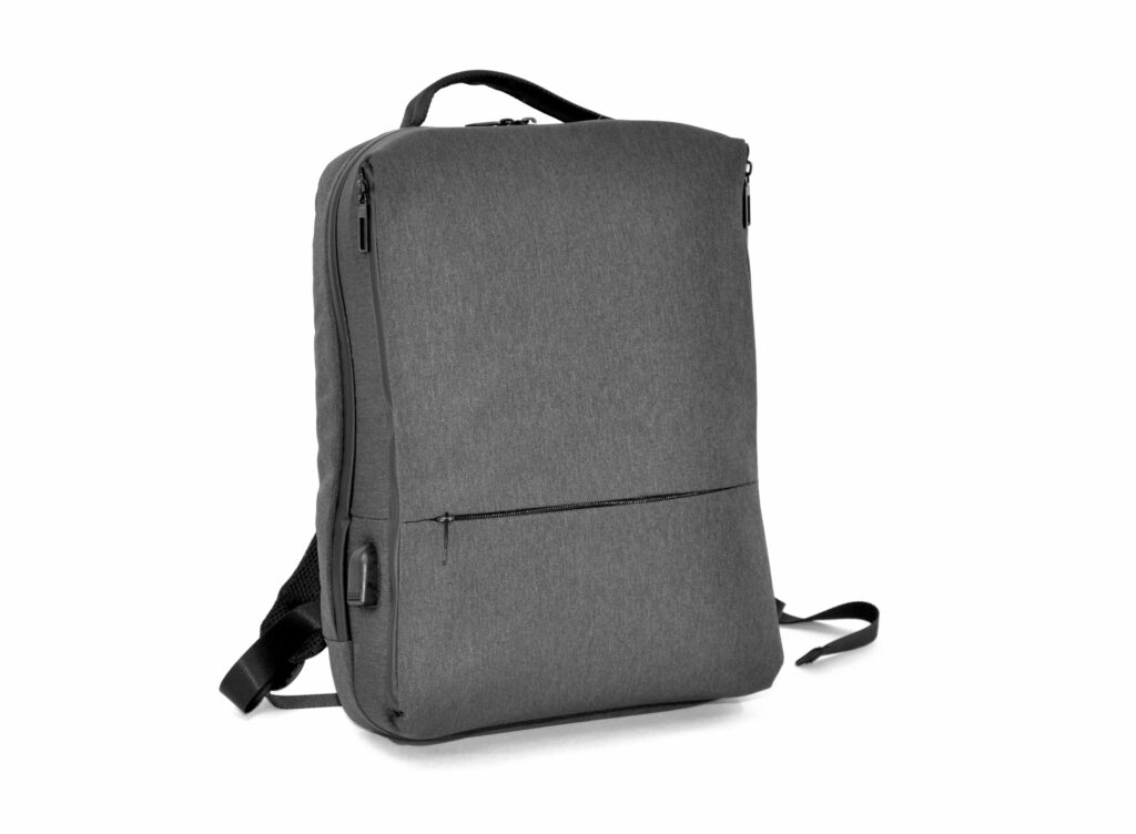 A grey, minimalist backpack with a zippered pocket on the front, black adjustable shoulder straps and a carrying handle on the top - ideal for B2B needs or customization - on a plain white background.