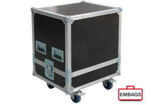 A black and silver flight case with metal reinforcements and handles on the sides, mounted on four caster wheels. The EMBAGS logo is visible in the bottom right corner.