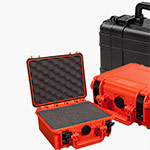 Three hard-shell protective cases are shown; two are orange, with one open revealing foam padding, and one is closed and black. All have secure latches and handles.